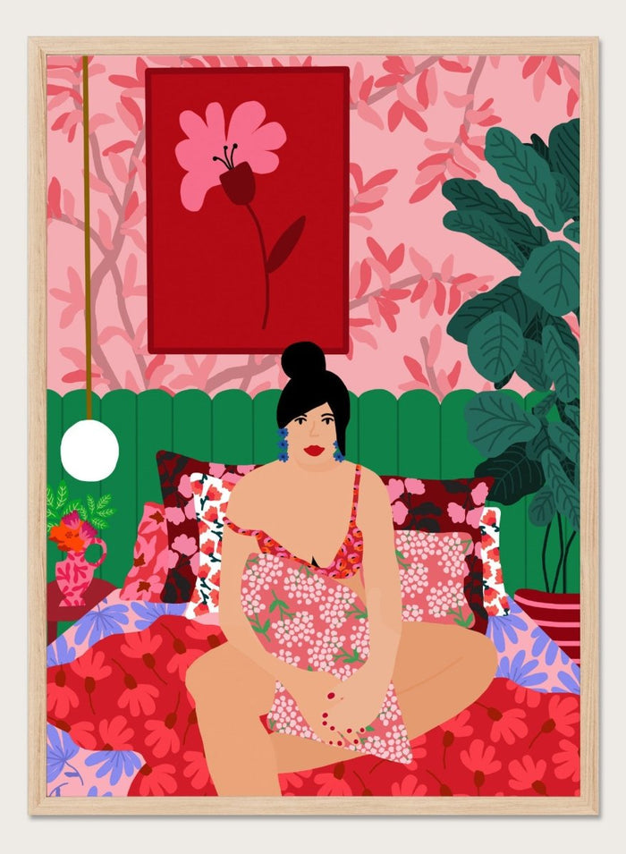 Illustration of a woman in a floral dress sitting on a bed with a colorful room setting. Floral Interior by Rafaela Mascaro is a colorful contemporary art print featuring floral patterns, lush houseplants, vibrant interiors, and joyful home decor inspiration.