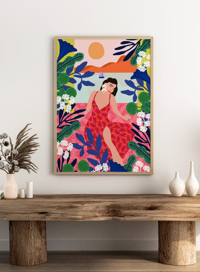 Woman in a red dress surrounded by tropical plants and flowers with a colorful sky. Floral Sunset Girl by Rafaela Mascaro is a vibrant tropical art print featuring bold florals, lush botanicals, coastal views, and colorful contemporary illustration.