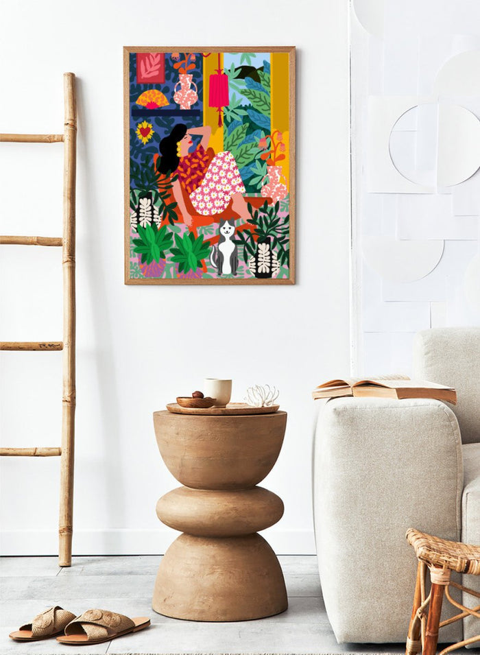 Colorful illustration of a woman in a floral dress sitting among plants and flowers. Flower Power by Rafaela Mascaro fine art print poster with lounging woman, daisy skirt, bold plants, patterned interior, contemporary modern aesthetic wall art.