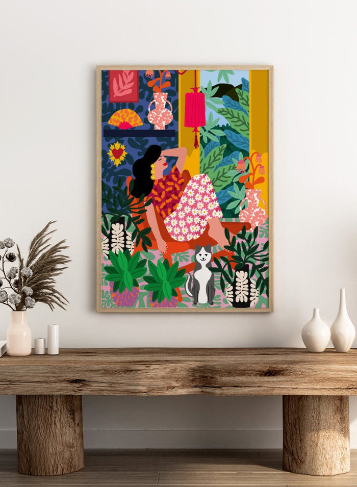 Colorful illustration of a woman in a floral dress sitting among plants and flowers. Flower Power by Rafaela Mascaro fine art print poster with lounging woman, daisy skirt, bold plants, patterned interior, contemporary modern aesthetic wall art.