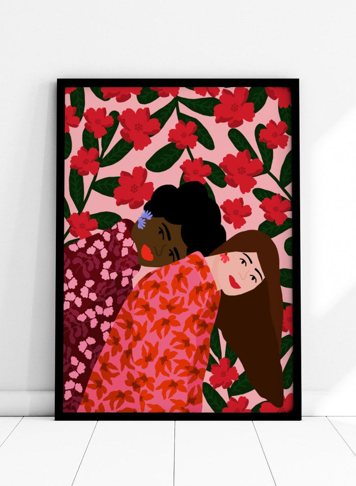 Illustration of two women embracing with a floral pattern in the background. Friendship by Rafaela Mascaro fine art print poster featuring two women embracing, red floral background, modern botanical wall art.