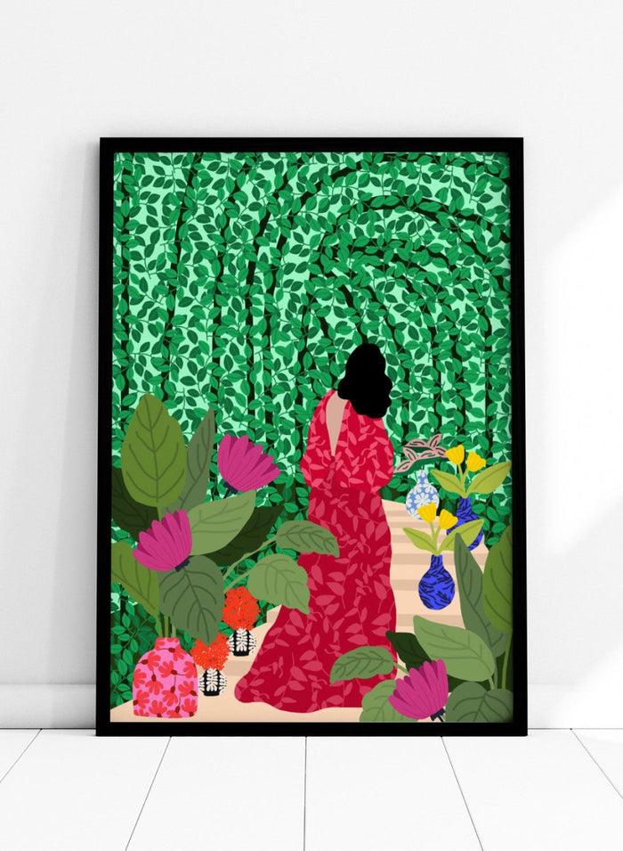 Girl at Her Garden by Rafaela Mascaro fine art print featuring lush green botanical background, red dress figure, and modern contemporary wall art poster.
