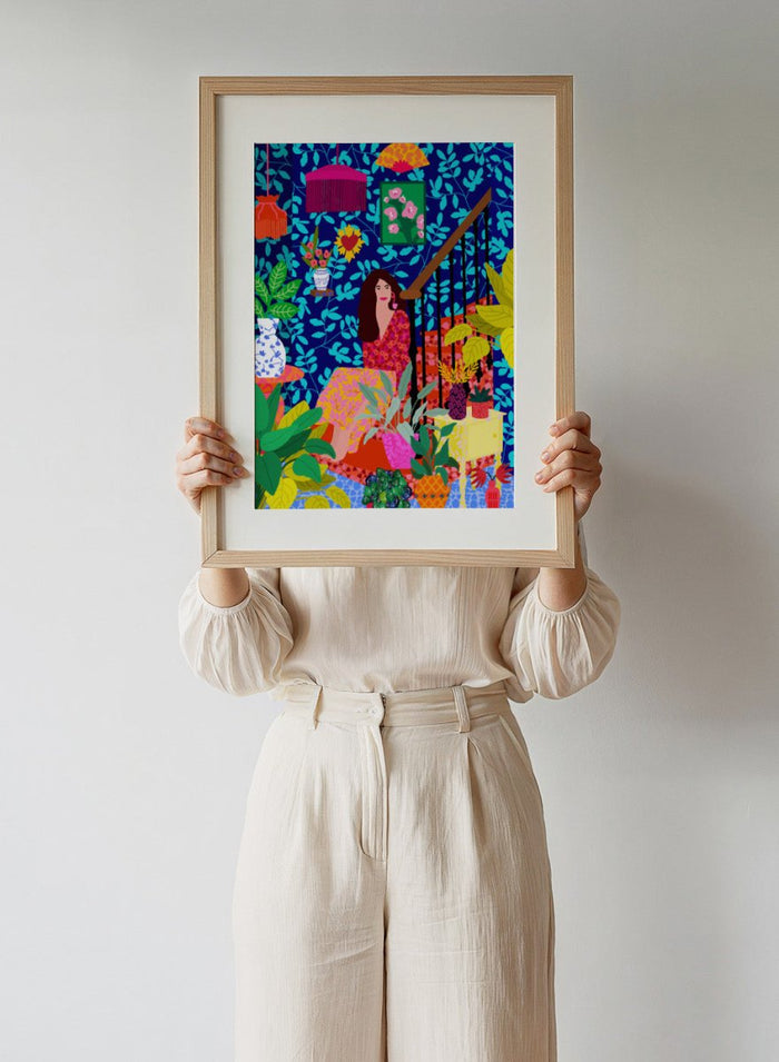 Colorful illustration of a woman sitting among plants and decorative items on a blue background. The Botanical Staircase by Rafaela Mascaro fine art print featuring blue botanical wallpaper, patterned staircase interior, modern contemporary wall art poster.