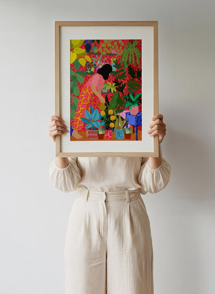 Colorful illustration of a person tending to plants with a vibrant background. Watering My Plants by Rafaela Mascaro fine art print featuring bold botanical interior, modern woman illustration, and colorful contemporary wall art poster.