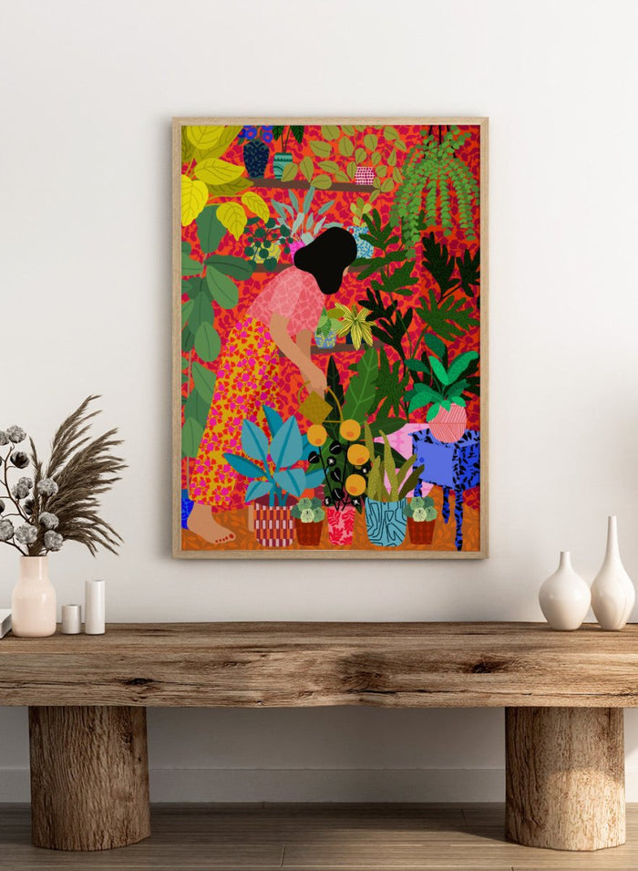 Colorful illustration of a person tending to plants with a vibrant background. Watering My Plants by Rafaela Mascaro fine art print featuring bold botanical interior, modern woman illustration, and colorful contemporary wall art poster.