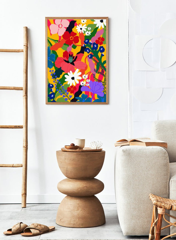 Colorful floral pattern with various flowers on a yellow background. Wildflower Tangle by Rafaela Mascaro botanical art print featuring bold colorful flowers, layered wildflower pattern, and vibrant contemporary floral wall art poster.