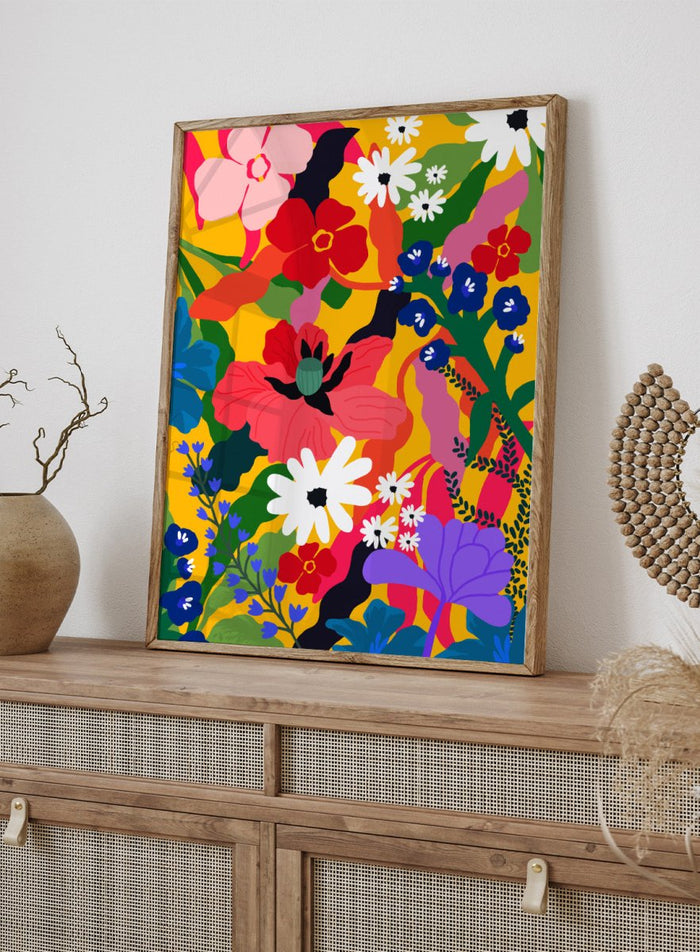 Colorful floral pattern with various flowers on a yellow background. Wildflower Tangle by Rafaela Mascaro botanical art print featuring bold colorful flowers, layered wildflower pattern, and vibrant contemporary floral wall art poster.