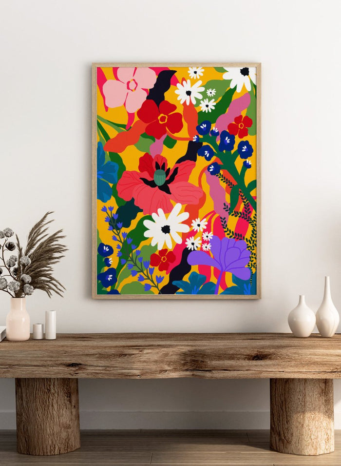 Colorful floral pattern with various flowers on a yellow background. Wildflower Tangle by Rafaela Mascaro botanical art print featuring bold colorful flowers, layered wildflower pattern, and vibrant contemporary floral wall art poster.