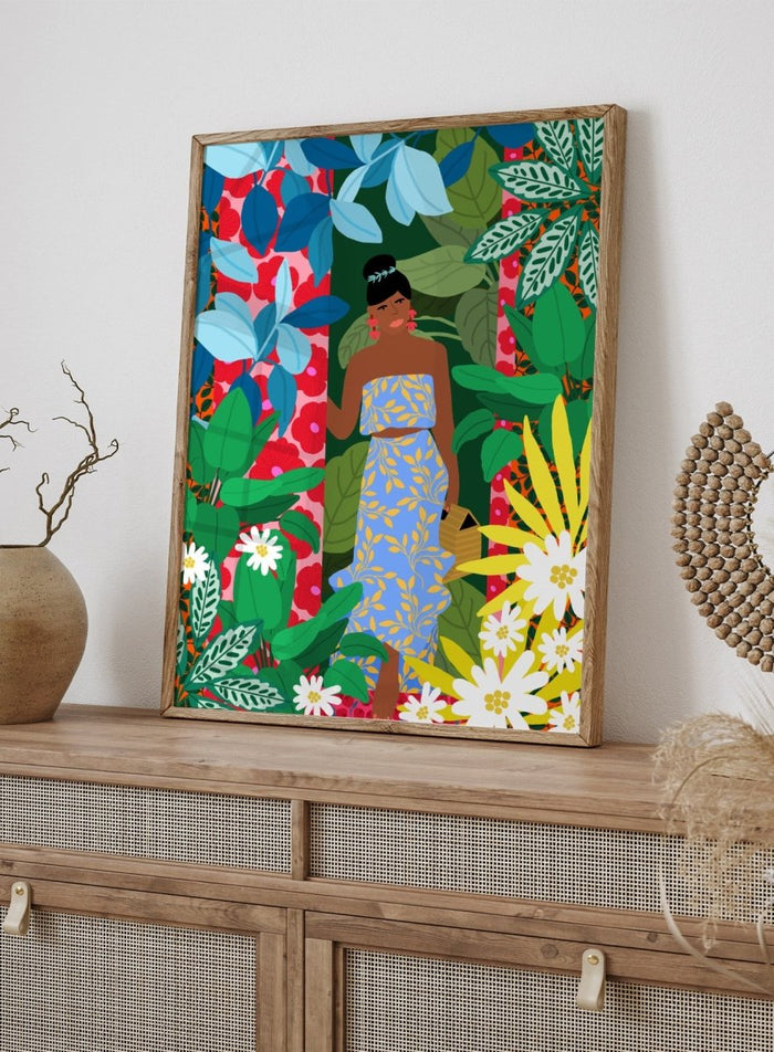 Woman in a blue dress surrounded by colorful foliage and flowers. Woman In A Dress With Flowers by Rafaela Mascaro is a vibrant botanical art print featuring lush foliage, colorful florals, decorative patterns, and tropical charm.
