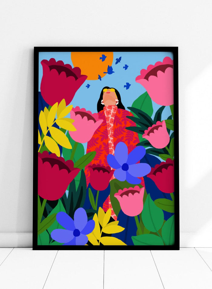 Colorful illustration of a woman surrounded by flowers and birds on a blue background. Woman in Flower Garden by Rafaela Mascaro fine art print poster featuring oversized tulips, bold florals, birds, modern contemporary botanical wall art.