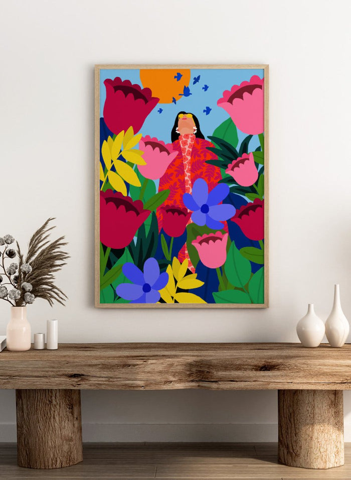 Colorful illustration of a woman surrounded by flowers and birds on a blue background. Woman in Flower Garden by Rafaela Mascaro fine art print poster featuring oversized tulips, bold florals, birds, modern contemporary botanical wall art.