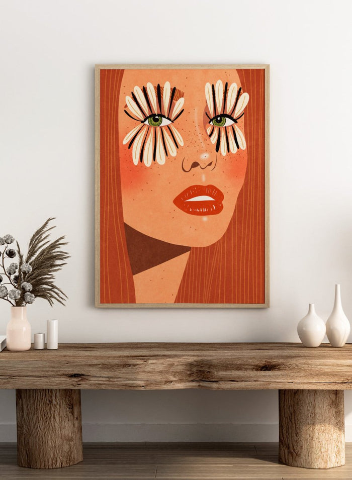 Illustration of a face with flower-like eyes on an orange background. Flower Eyes by Raissa Oltmanns fine art print featuring bold female portrait with floral lashes, modern contemporary wall decor poster.
