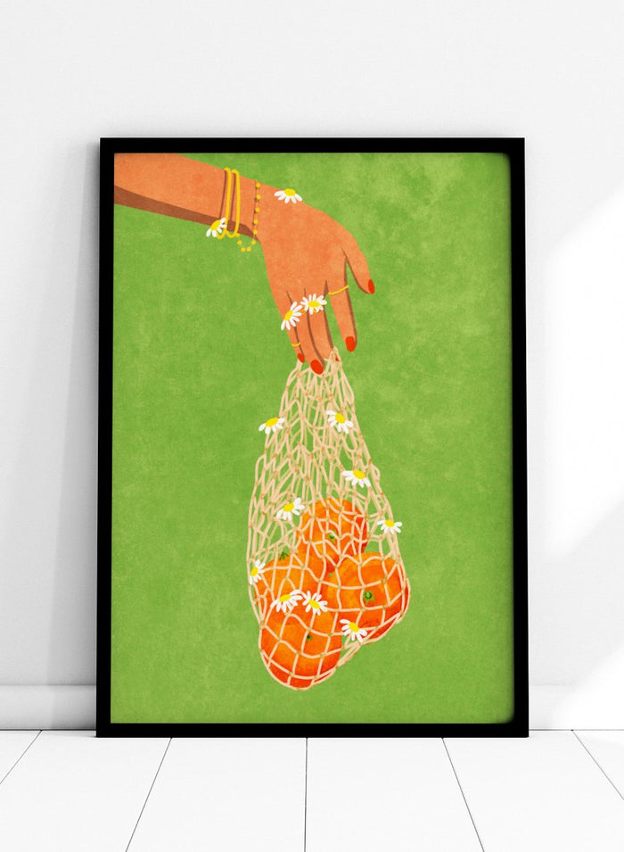 Illustration of a hand holding a bag of oranges with a green background. Fresh Oranges by Raissa Oltmanns fine art print featuring modern fruit illustration, stylish feminine hand art, contemporary kitchen wall decor poster.