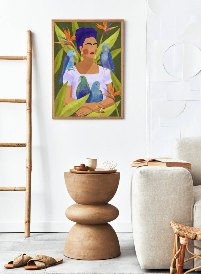 Artistic depiction of a woman with blue hair surrounded by parrots and tropical plants. Frida and Birds by Raissa Oltmanns is a modern Frida Kahlo inspired art print with tropical birds and bold botanical wall poster design.