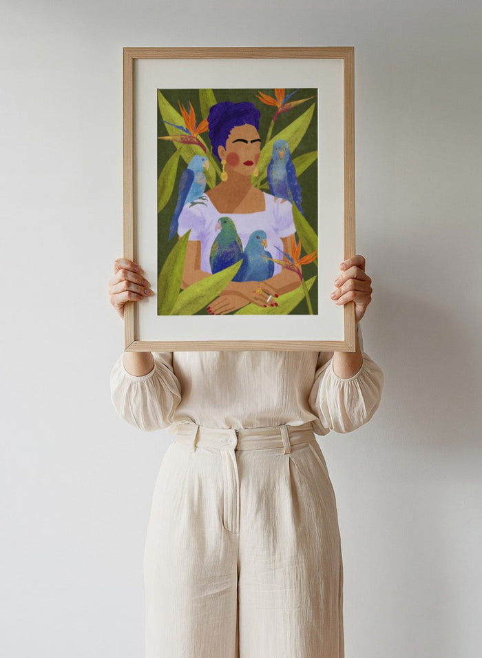 Artistic depiction of a woman with blue hair surrounded by parrots and tropical plants. Frida and Birds by Raissa Oltmanns is a modern Frida Kahlo inspired art print with tropical birds and bold botanical wall poster design.