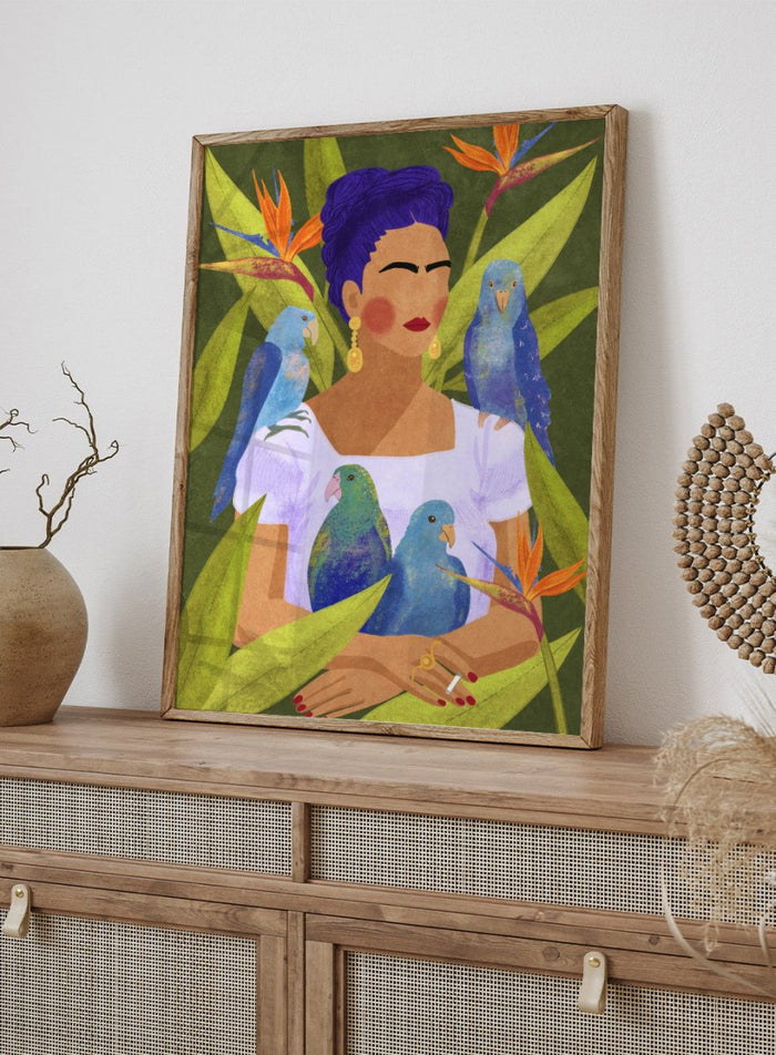 Artistic depiction of a woman with blue hair surrounded by parrots and tropical plants. Frida and Birds by Raissa Oltmanns is a modern Frida Kahlo inspired art print with tropical birds and bold botanical wall poster design.