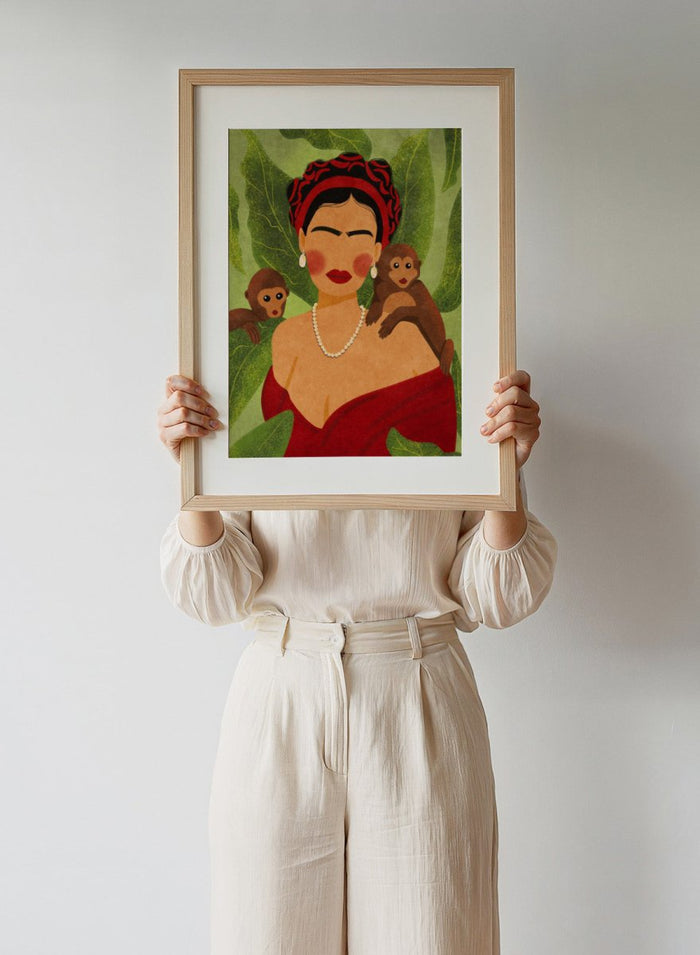 Illustration of a woman with two monkeys on a green leafy background. Frida and Monkeys by Raissa Oltmanns fine art print featuring modern Frida Kahlo portrait with monkeys, bold contemporary wall decor poster.