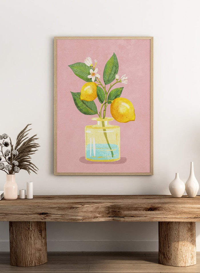 Illustration of lemons and a flower in a glass bottle on a pink background. Lemon Bunch In Vase by Raissa Oltmanns is a modern lemon still life art print featuring citrus fruit and floral kitchen wall poster design.
