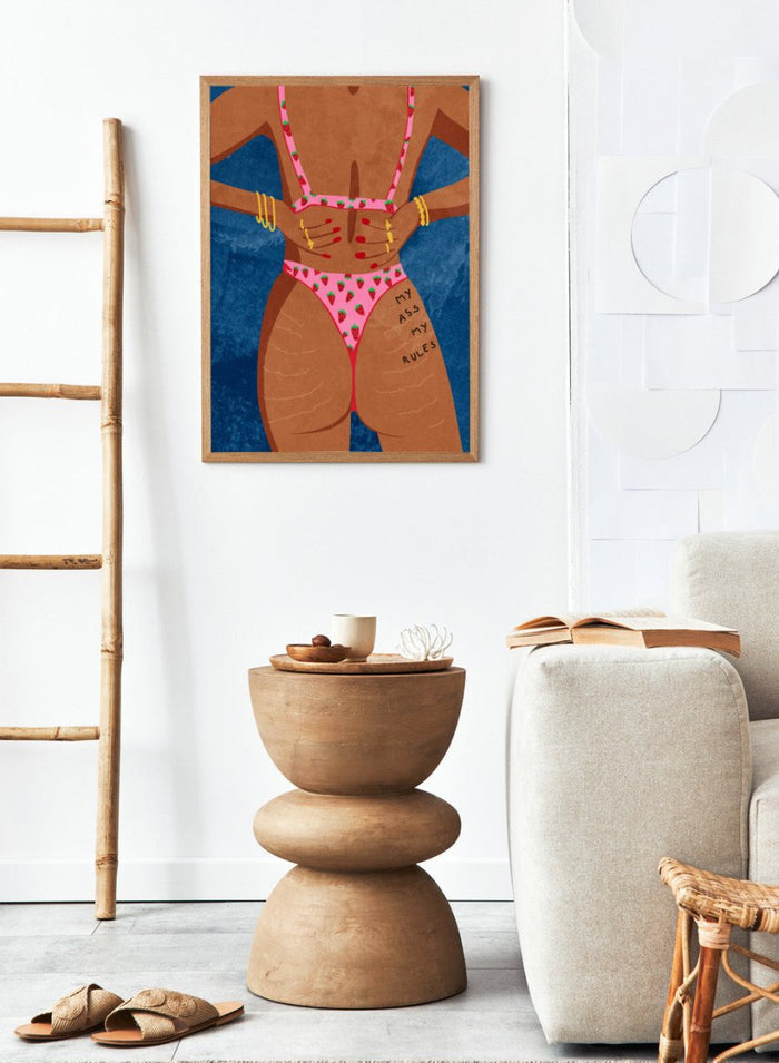 Illustration of a person wearing a pink bikini with strawberry pattern against a blue background. My Ass My Rules by Raissa Oltmanns is a modern woman portrait art print featuring a bold bikini illustration and confident statement wall poster.