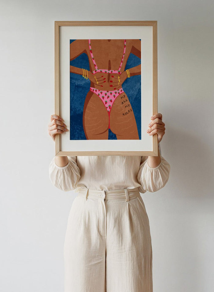 Illustration of a person wearing a pink bikini with strawberry pattern against a blue background. My Ass My Rules by Raissa Oltmanns is a modern woman portrait art print featuring a bold bikini illustration and confident statement wall poster.