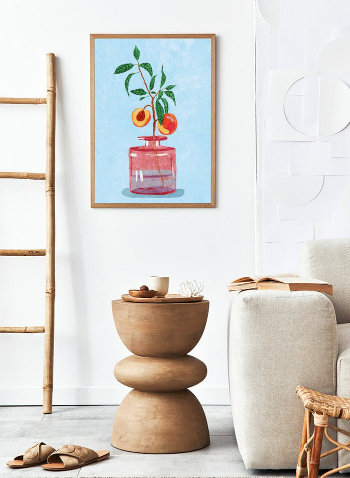 Illustration of a peach tree in a glass vase against a light blue background. Peach Tree in Vase by Raissa Oltmanns is a modern peach still life art print with fruit branch and kitchen wall poster design.