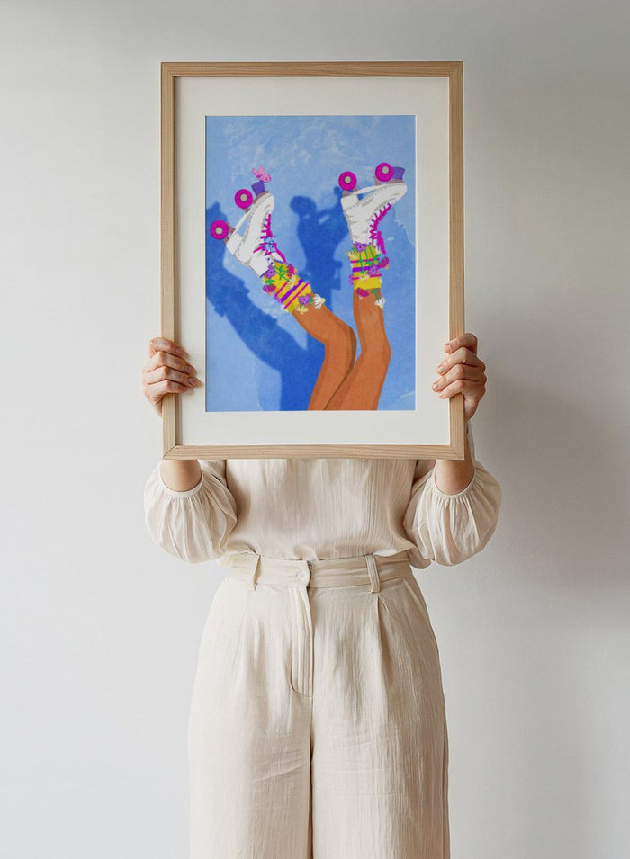 Colorful roller skates with pink and purple wheels on a blue background. Skate Like a Girl by Raissa Oltmanns fine art print featuring colorful roller skate illustration, bold feminine wall decor, modern contemporary poster design.
