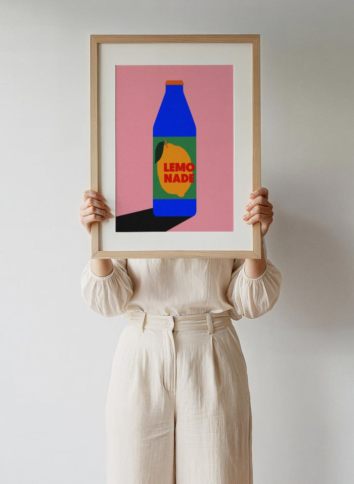 Blue bottle labeled 'Lemonade' with a lemon graphic on a pink background. Lemonade by Rosi Feist is a contemporary food and drink art print, perfect as modern kitchen poster wall decor with bold graphic design.