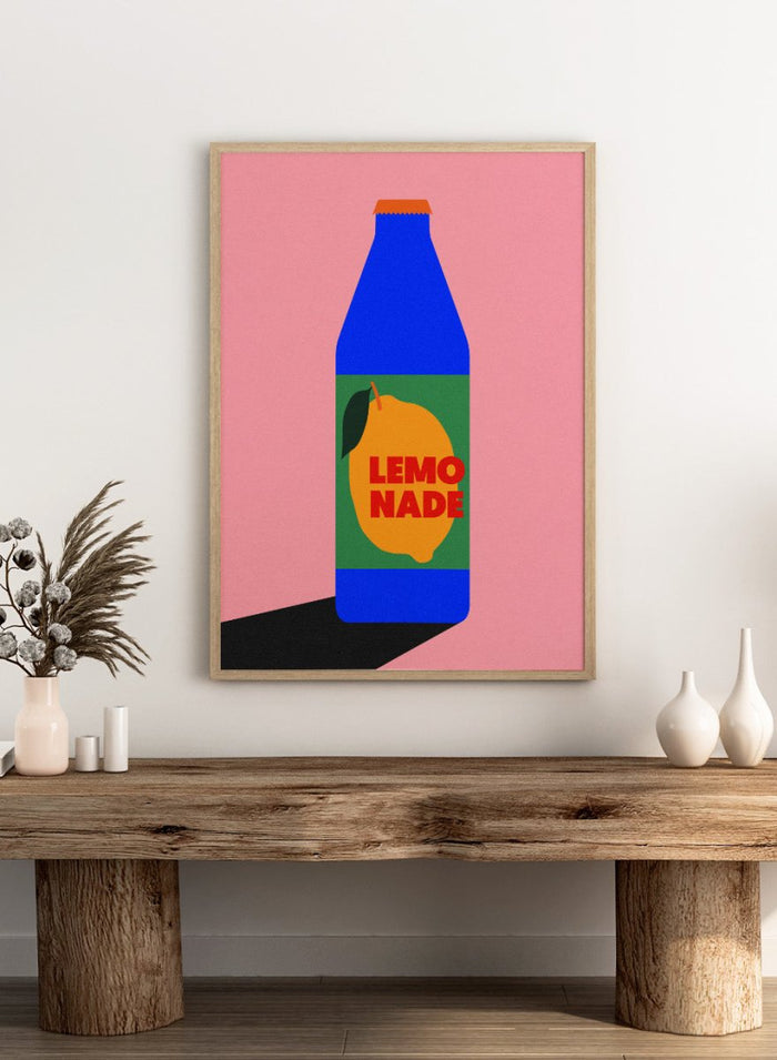Blue bottle labeled 'Lemonade' with a lemon graphic on a pink background. Lemonade by Rosi Feist is a contemporary food and drink art print, perfect as modern kitchen poster wall decor with bold graphic design.