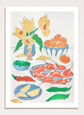 A framed still life art print featuring yellow tulips in a blue vase, bowls of oranges, red shrimp, green peppers, and yellow lemon wedges. Shop Fresh Flowers and Feast by Rushati Chowdhury, a colorful food and floral art print featuring shrimp, oranges, peppers, greens, lemon, and yellow flowers.