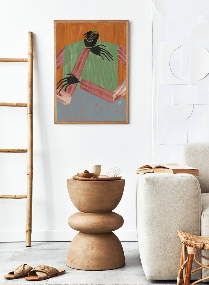 Artistic depiction of a person with spider-like hands and feet against a wooden background. No Place to Be by Studio IMO (Ibi Meier-Oruitemeka) is a modern figurative art print with a seated figure, bold color, and contemporary portrait wall poster design.