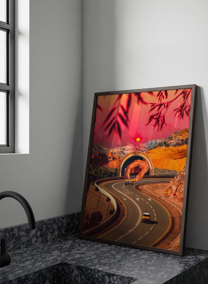 Winding road with a large hand-like structure in a desert landscape during sunset. Play Time by Taudalpoi surreal retro road trip art print with giant hand, desert highway and vintage car collage, cosmic inspired poster wall art.