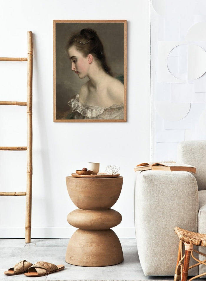 The Debutant by Gustave Jean Jacquet is a vintage portrait print of a young woman in profile with pearls in her hair and a white ruffled dress.
