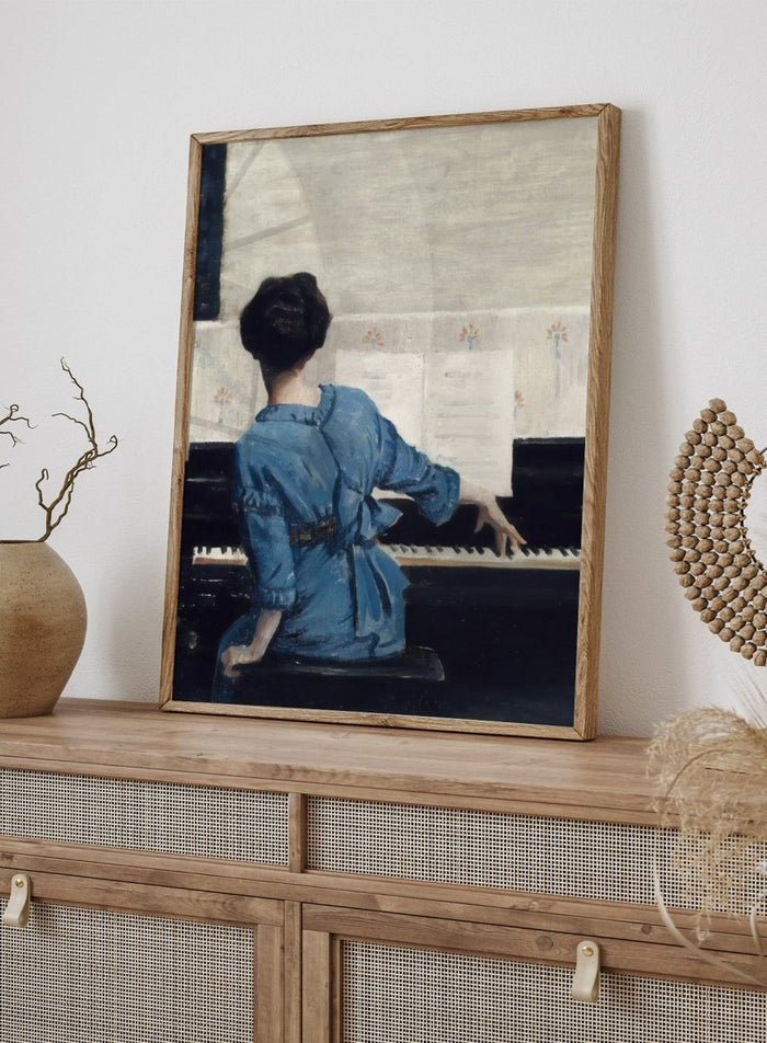 The Keynote by William Merritt Chase is a vintage piano print of a woman in a blue robe playing piano, a music room scene in soft blue tones.