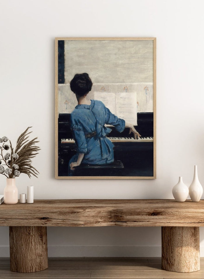 The Keynote by William Merritt Chase is a vintage piano print of a woman in a blue robe playing piano, a music room scene in soft blue tones.