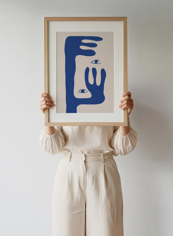 Abstract face art print by The MIUUS Studio featuring bold blue shapes and minimalist design. Contemporary modern wall art poster with graphic abstract portrait.