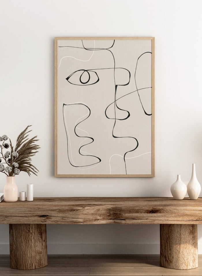 Abstract line art of a face on a beige background. Abstract Facescape by The MIUUS Studio is a minimalist abstract line art print and wall poster featuring continuous line drawing, modern face illustration, and neutral tones.