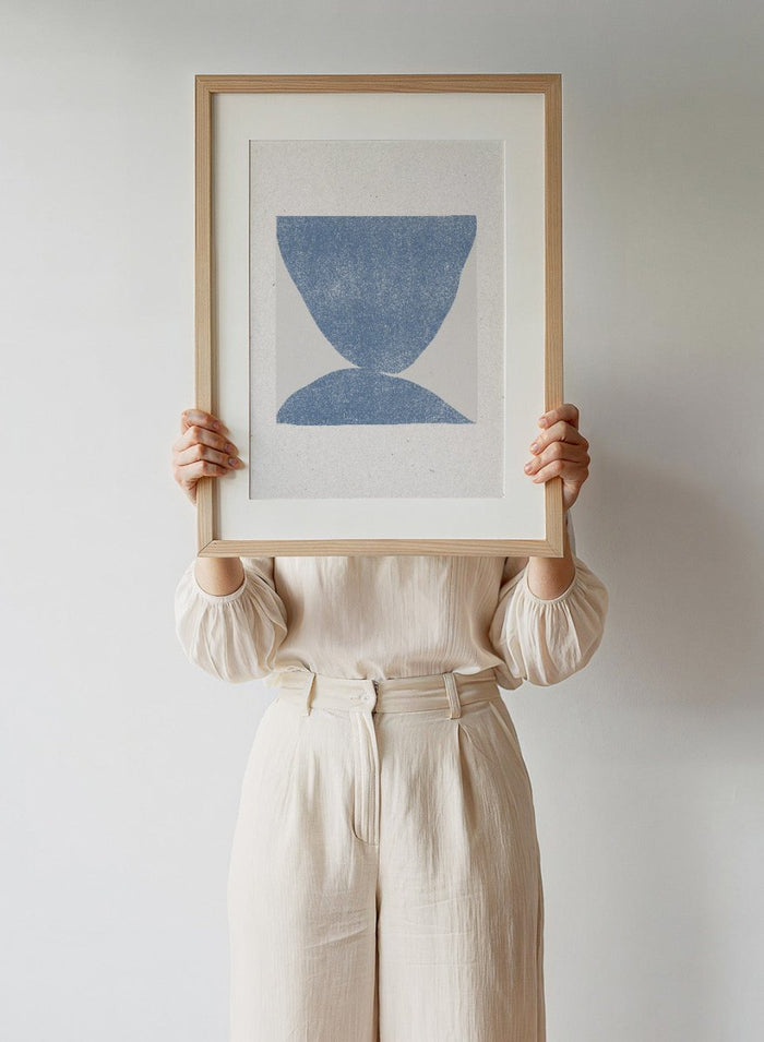 Blue Symmetry by The MIUUS Studio is a modern abstract art print exploring balance, minimal form, and texture. Officially licensed fine art poster with optional framing.