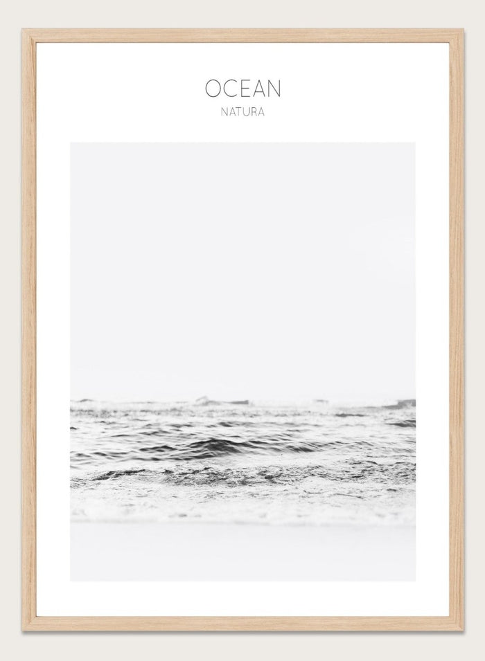 Black and white ocean wave with 'OCEAN Natura' text at the top. Endless Waves by The MIUUS Studio is a minimalist ocean photography art print and wall poster featuring soft waves, neutral tones, and modern coastal design.
