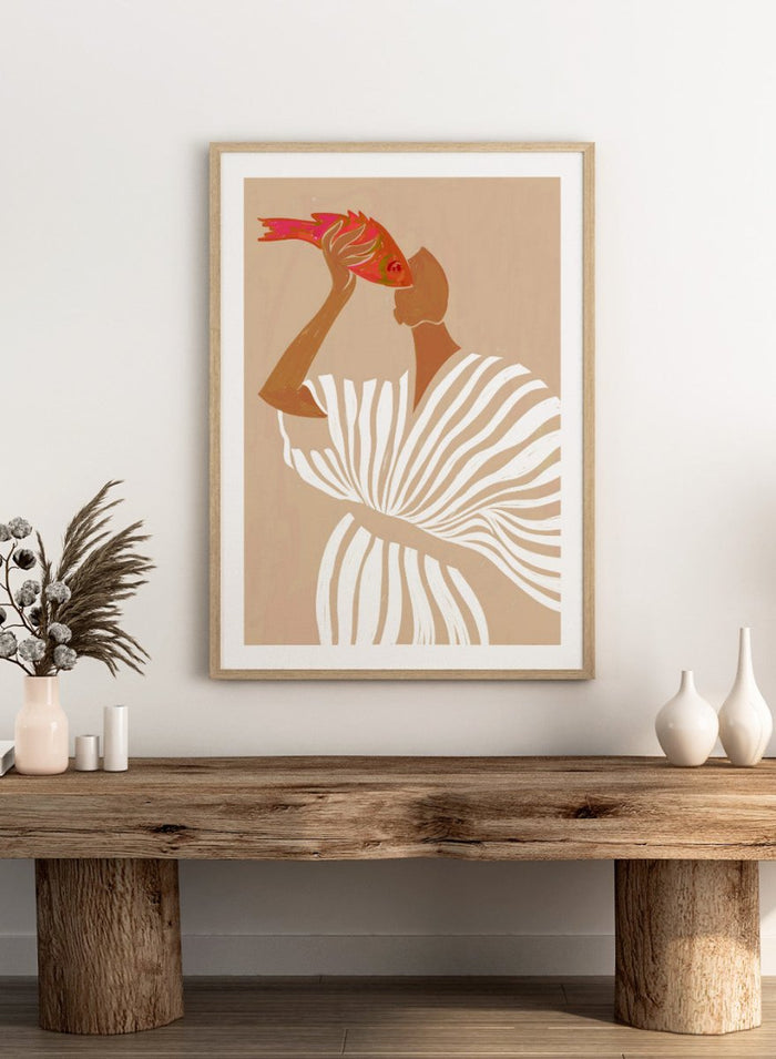 Fish Eye Paradox by Uma Gokhale is a figurative art print showing a woman holding a fish in an intimate portrait. Premium fine art print with real wood framing.