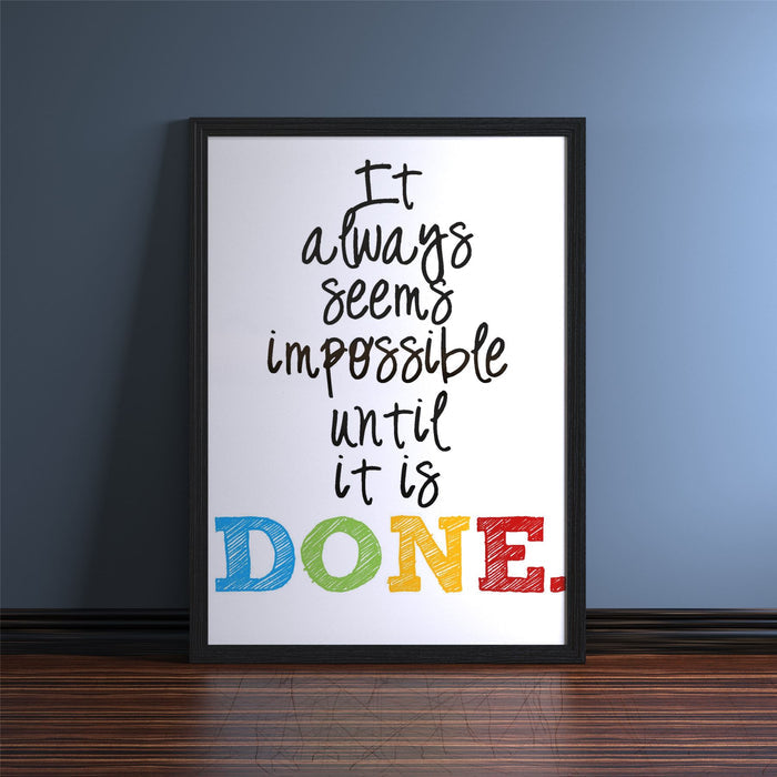 Black picture and poster frame displaying motivational quote 'It always seems impossible until it is DONE.'