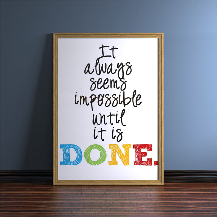 Oak picture and poster frame featuring the quote 'It always seems impossible until it is DONE.' against a blue background.